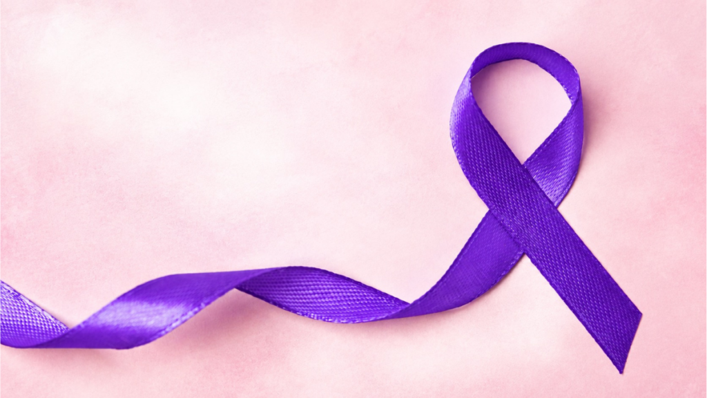 Ruban violet symbole de la maladie d’Alzheimer sur un fond rose clair